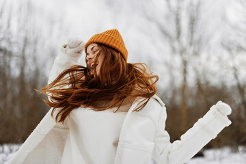 Happy young woman Walk in winter field landscape outdoor entertainment There is a lot of snow around