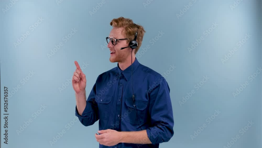 Call center employee talking with earphones with microphone isolated on blue color background