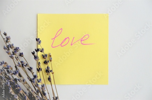 postcard with the inscription love and lavender flowers