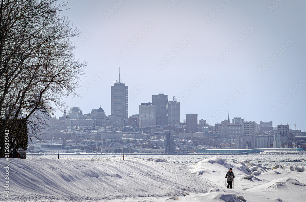 Quebec city skyline from the Island of Orleans, in winter, with the frozen St Lawrence River, Quebec City, Canada