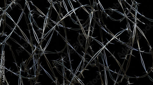 Barbed wire on black background photo