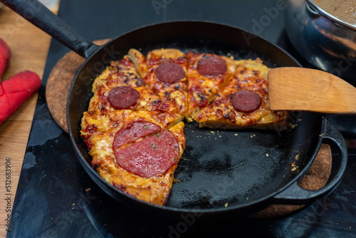 Homemade Pepperoni salami pizza in a metal pan