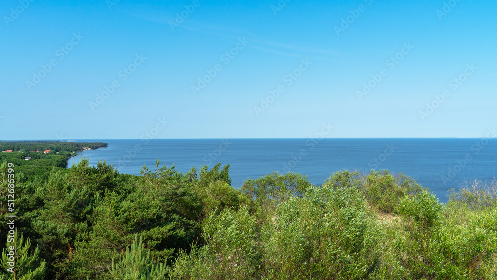 View of Curonian Spit or Courish Spit. It separates the Curonian Lagoon from Baltic Sea coast between Kaliningrad Oblast, Russia and southwestern Klaipeda County, Lithuania. View of Curonian Spit or Courish Spit. It separates the Curonian Lagoon from Baltic Sea coast between Kaliningrad Oblast, Russia and southwestern Klaipeda County, Lithuania.