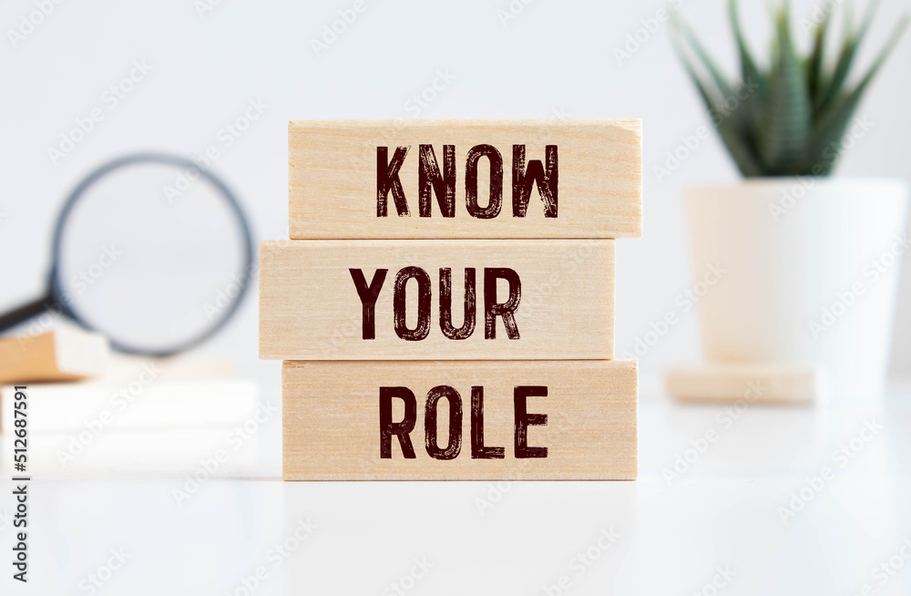 Business message KNOW YOUR ROLE written with chalk on wooden mini blackboard labels. Business message KNOW YOUR ROLE written with chalk on wooden mini blackboard labels.