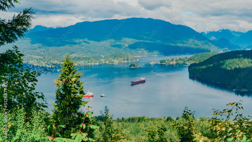 Oil tankers moored on scenic Burrard Inlet near Port Moody, BC.