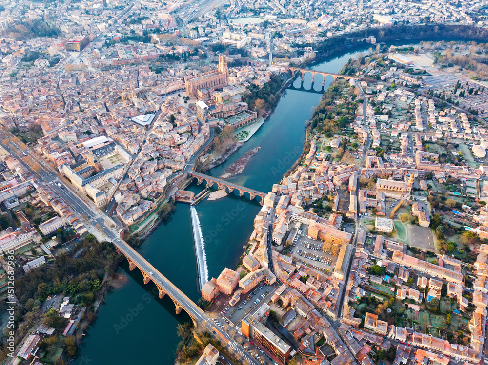 Fototapeta premium Aerial view of French city of Albi on bank of Tarn river in autumn day