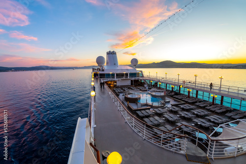 Deck view of the upper level and pool area of the Azamara Quest cruise ship at sunset on the Mediterranean Sea near Saint-Tropez, France on June 1 2022.