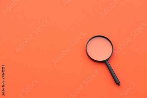 magnifying glass on red background