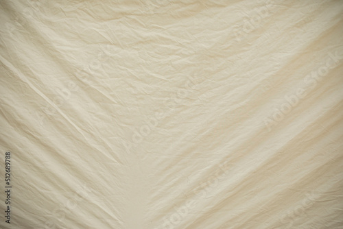 White awning with creases from tension. Texture of white fabric. Rubber material.