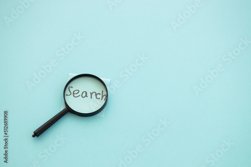 magnifying glass on blue background. Search concept