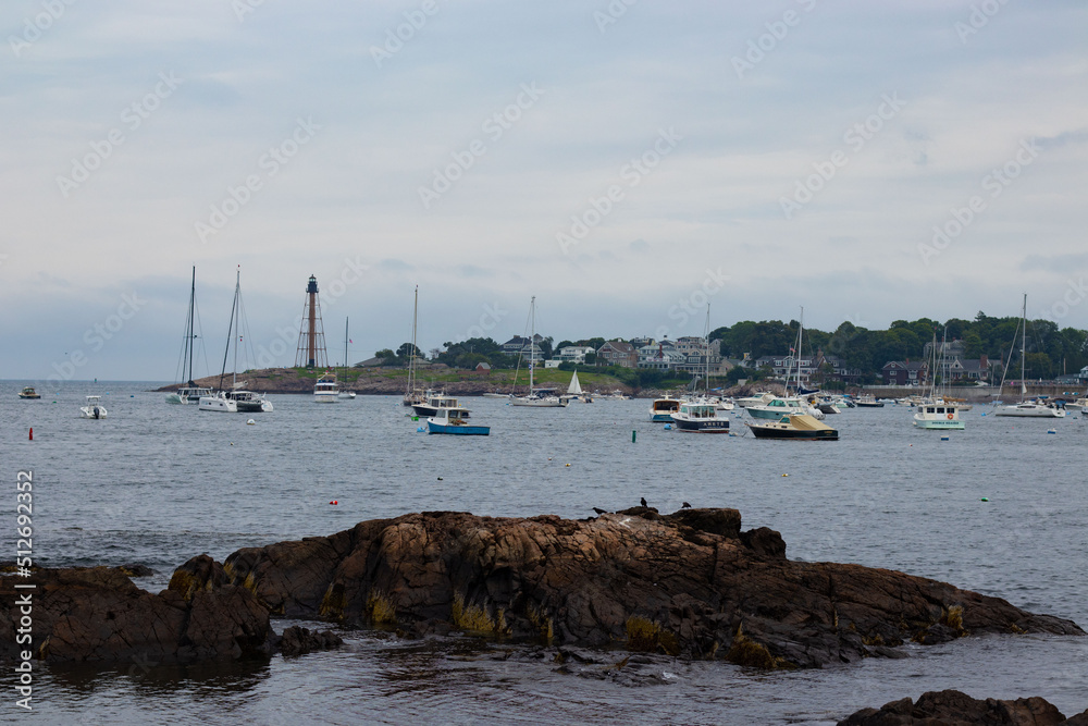 Rocky shoreline with boats in Salem