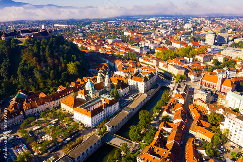 Fototapeta Panoramic aerial view of Ljubljana downtown with ancient castle complex on hillt