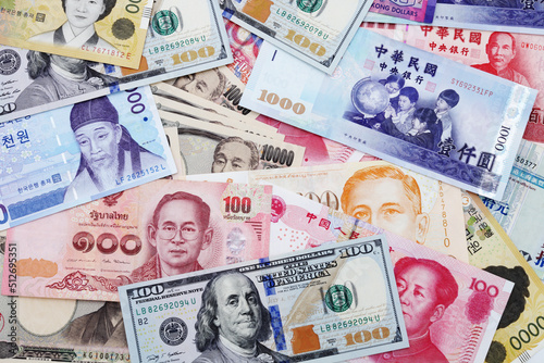 Background of banknotes from different countries. U.S. dollar, Chinese yuan, Japanese yen, Korean won, Thai baht banknotes, etc.