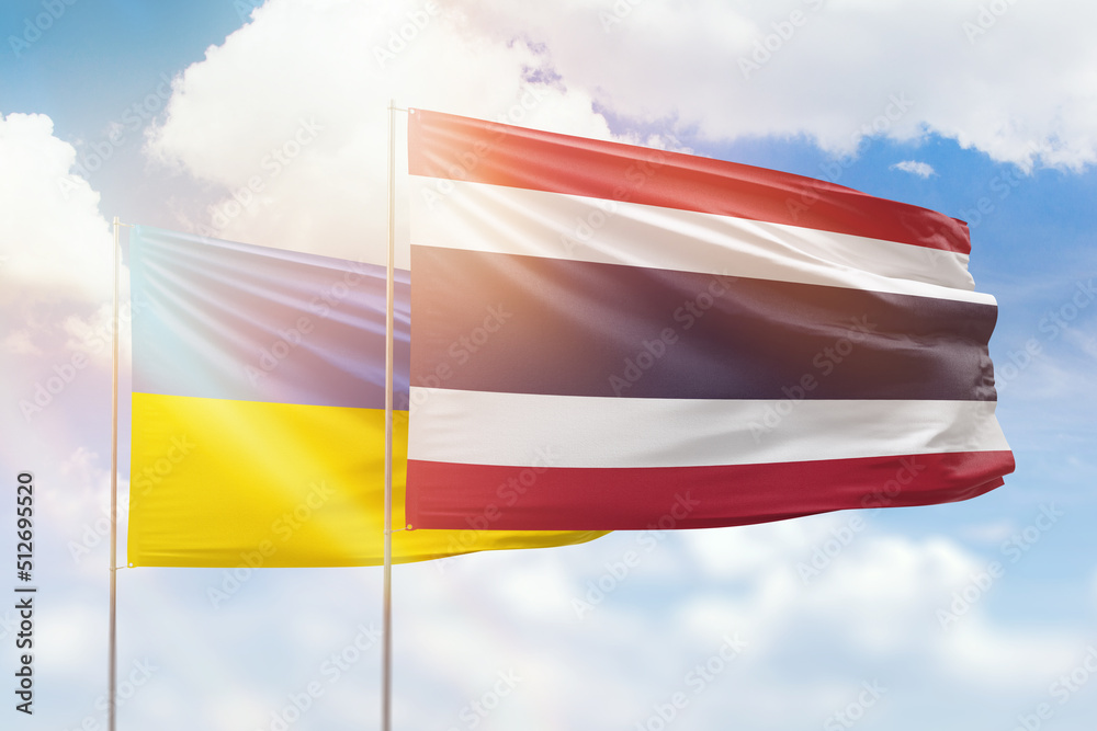 Sunny blue sky and flags of thailand and ukraine Sunny blue sky and flags of thailand and ukraine