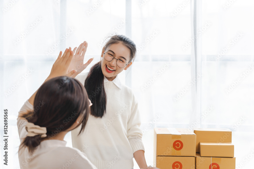 Partnership of SME entrepreneur teamwork of small business work at home family online marketing with packing box prepare for deliverty to customers at warehouse home seller office. Partnership of SME entrepreneur teamwork of small business work at home family online marketing with packing box prepare for deliverty to customers at warehouse home seller office.