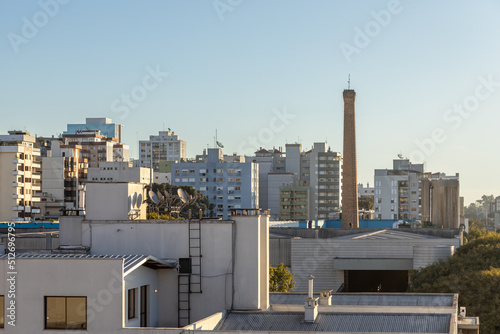 View of buildings in Caxias do Sul city centre at sunset time. Sunlight and blue sky. Rio Grande do Sul, Brazil