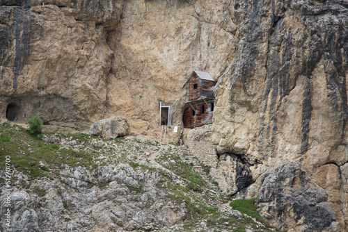 Wooden building in mountain rock, Cengia Martini footpath, Lagazuoi, Italian Alps. photo