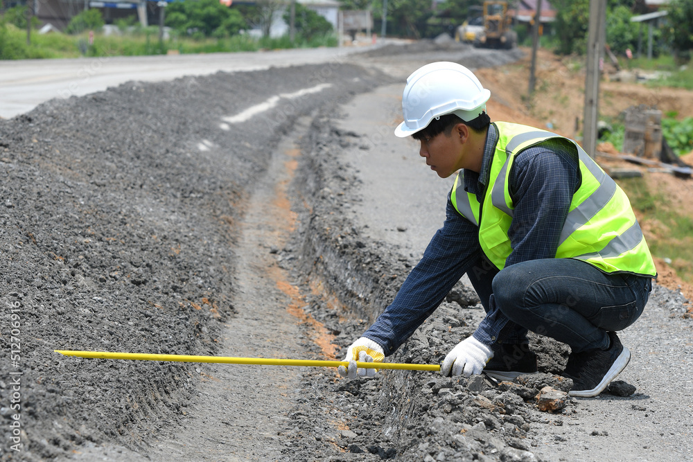 road engineer Checking the size of the job Engineer checking damaged road road engineer Checking the size of the job Engineer checking damaged road