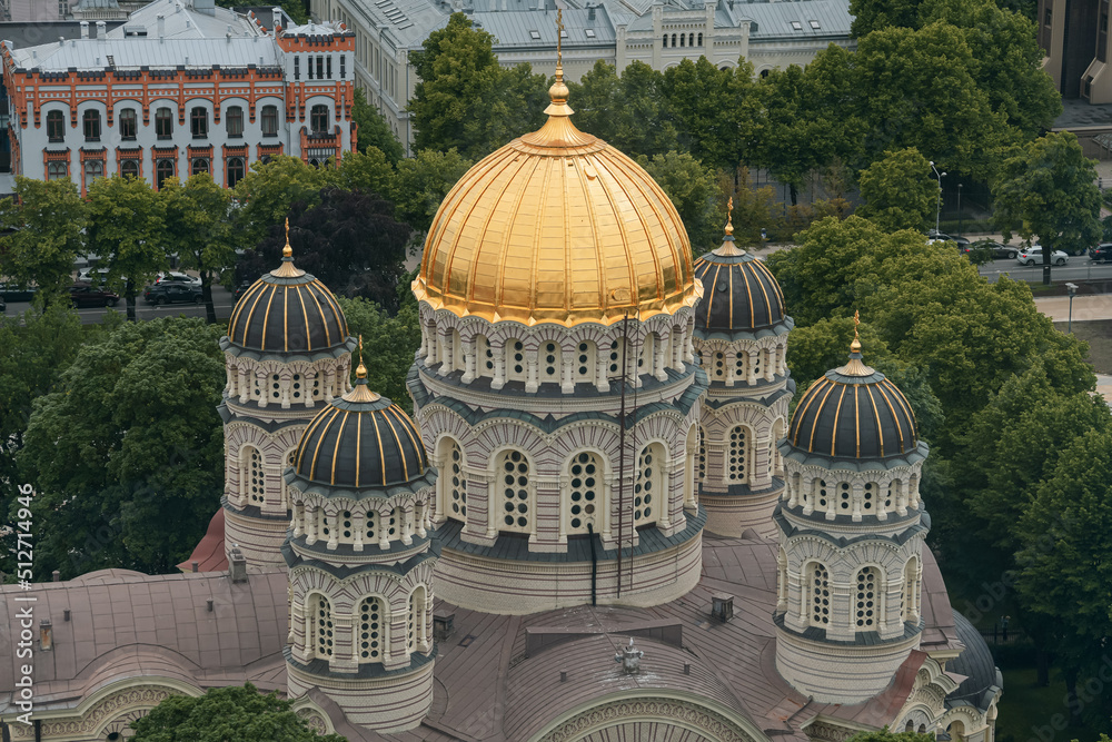 Fototapeta premium Riga from above. Aerial view over Nativity of Christ Orthodox Cathedral and Bastejkalna Park, landmarks in the capital city of Latvia, during a cloudy summer day.