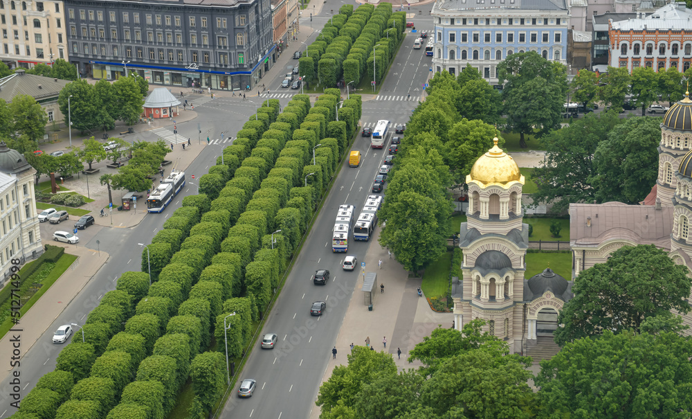 Riga from above. Aerial view over Nativity of Christ Orthodox Cathedral and Bastejkalna Park, landmarks in the capital city of Latvia, during a cloudy summer day.