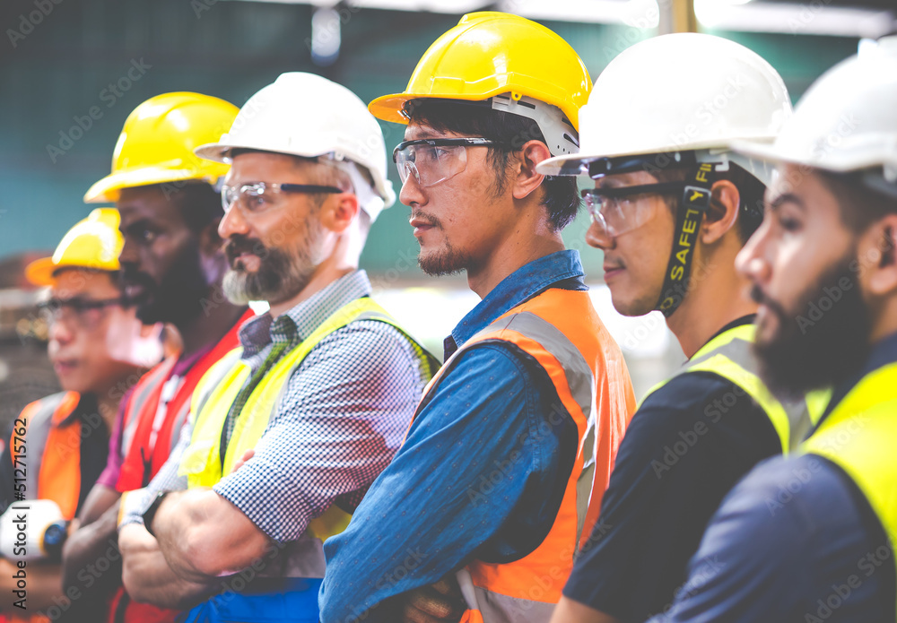 Arms crossed. Professional team working at workplace. Unity and teamwork concept. Portrait engineer factory manager worker and mechanic team together in factory workplace Arms crossed. Professional team working at workplace. Unity and teamwork concept. Portrait engineer factory manager worker and mechanic team together in factory workplace