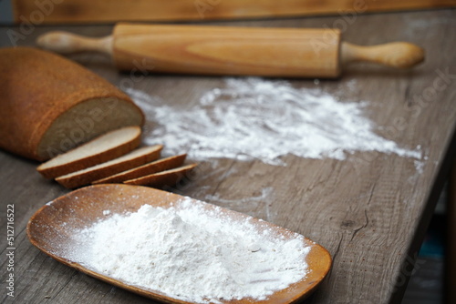 Kazakhstani tenge is lying on the table with scattered flour.