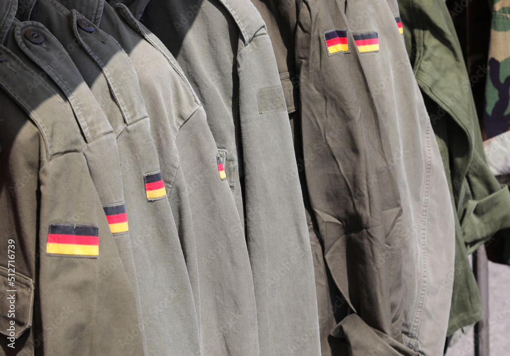 Green Military jackets of the German army uniform with the flag Stock-Foto  | Adobe Stock