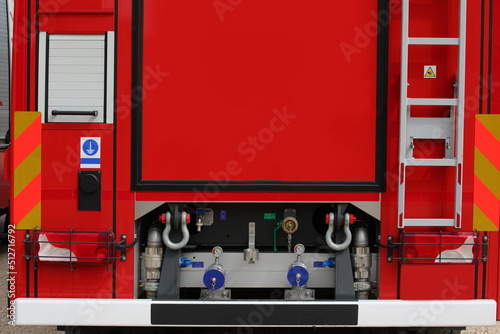 fire brigade truck with hose connection to use the high pressure water of the car pump when turning off the incisors photo
