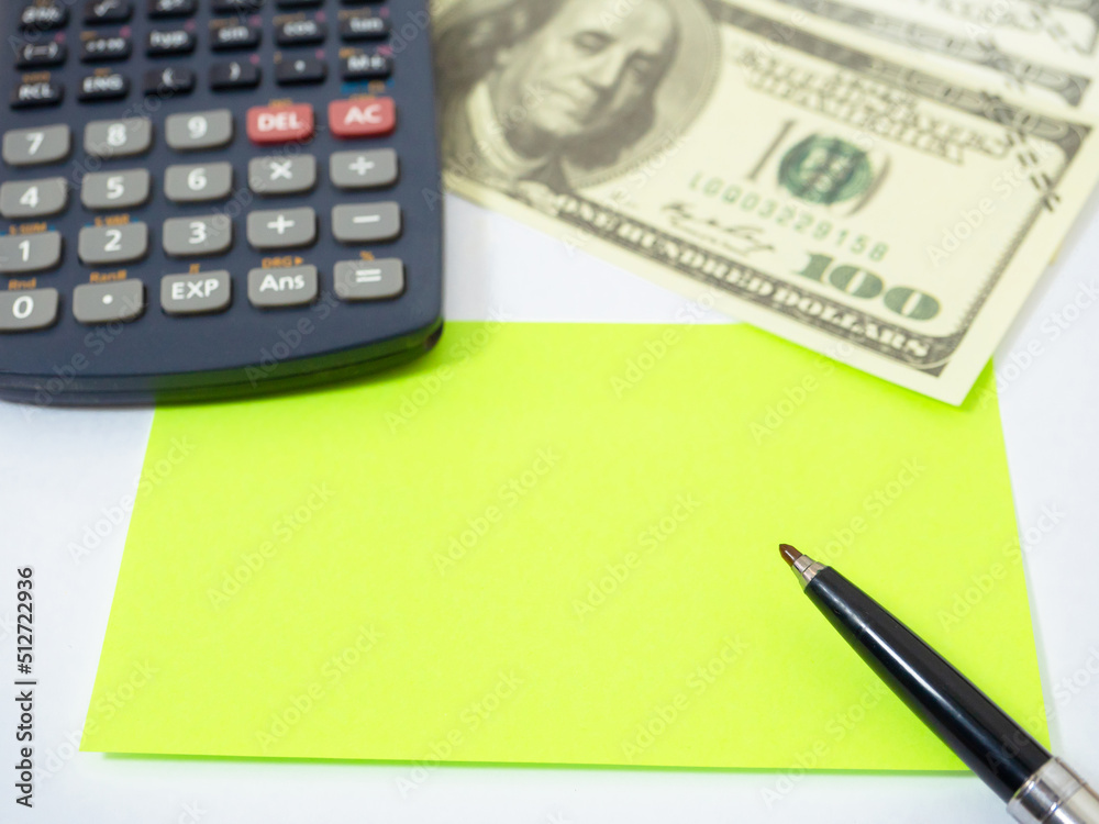 Closeup paper on workplace,Top view calculator money and noted Closeup paper on workplace,Top view calculator money and noted