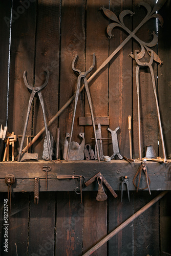 Hardware and tools in the smithy. Interior of an old blacksmith in Europe.
