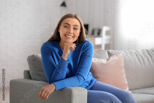 Happy senior woman sitting ...