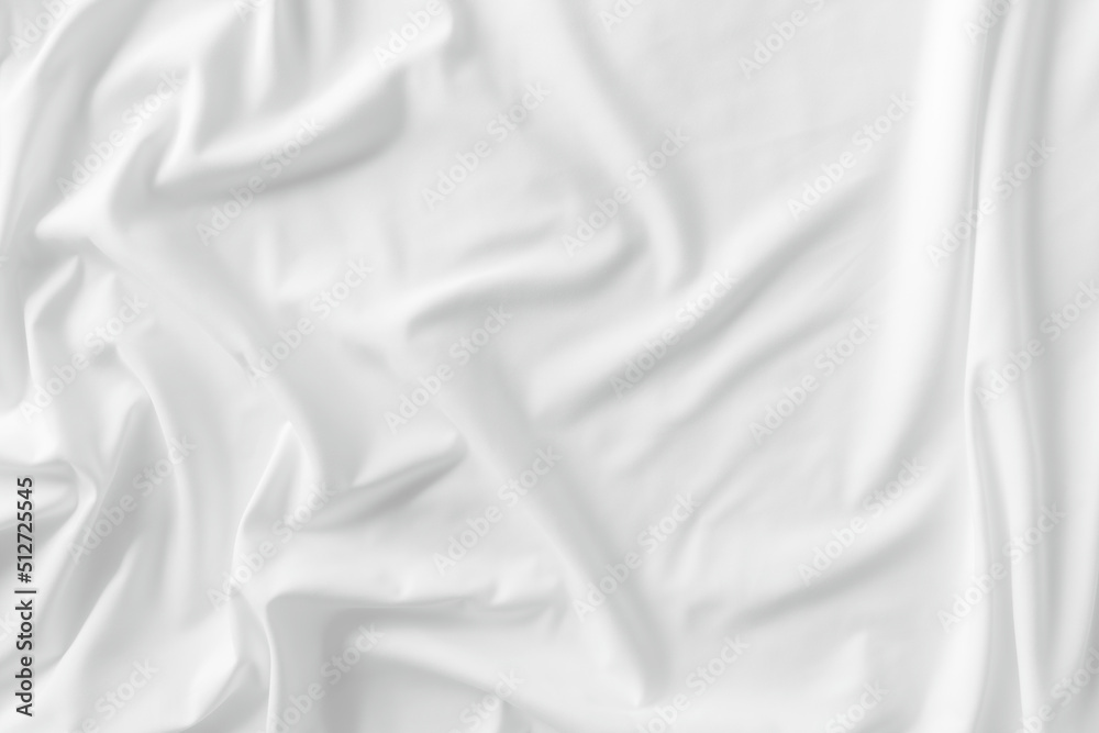 Fototapeta premium White fabric. luxurious white fabric texture background. Creases of satin, silk, and cotton.
