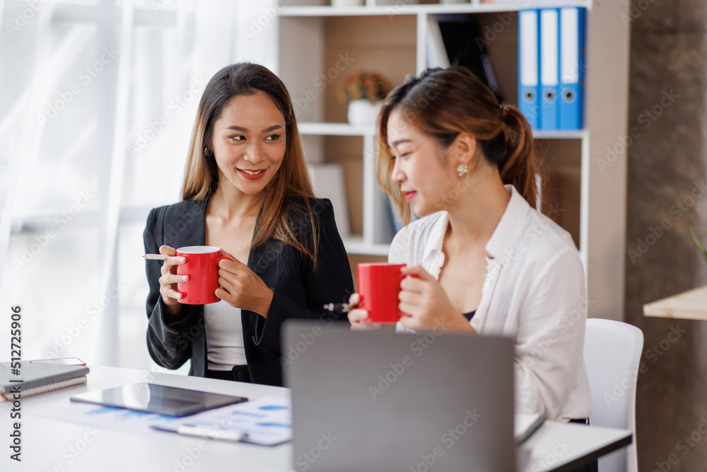 Cropped shot of Asian Business woman diverse coworkers working together in the boardroom, brainstorming, discussing, and analyzing business report strategy collaboration. Cropped shot of Asian Business woman diverse coworkers working together in the boardroom, brainstorming, discussing, and analyzing business report strategy collaboration.