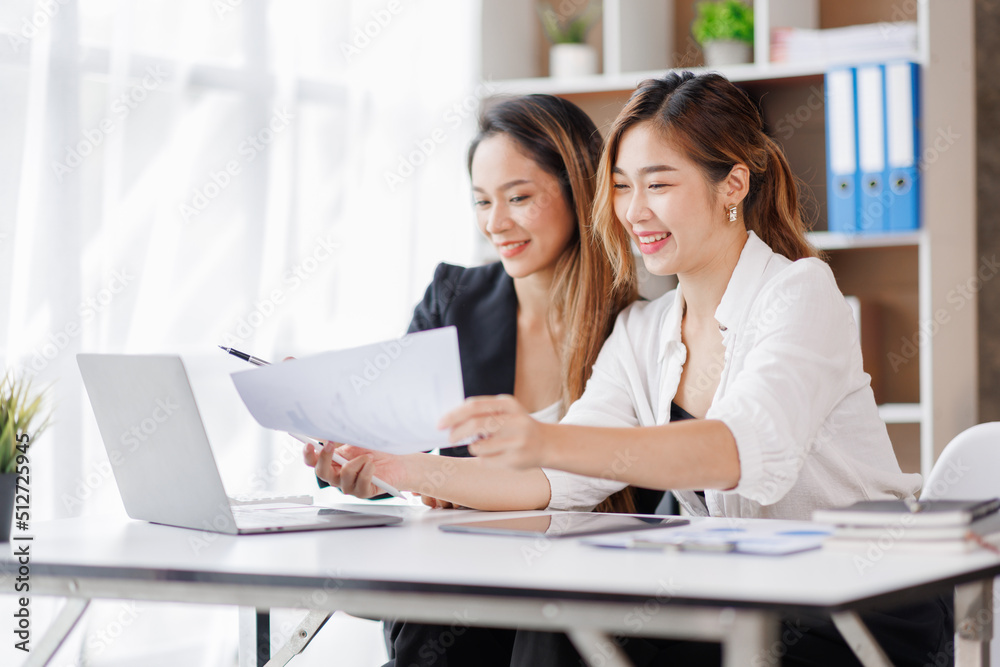 Cropped shot of Asian Business woman diverse coworkers working together in the boardroom, brainstorming, discussing, and analyzing business report strategy collaboration. Cropped shot of Asian Business woman diverse coworkers working together in the boardroom, brainstorming, discussing, and analyzing business report strategy collaboration.
