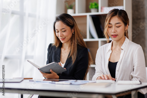 Cropped shot of Asian Business woman diverse coworkers working together in the boardroom, brainstorming, discussing, and analyzing business report strategy collaboration.