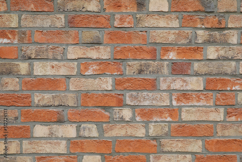Close up red brick stone wall with rough surface, no person