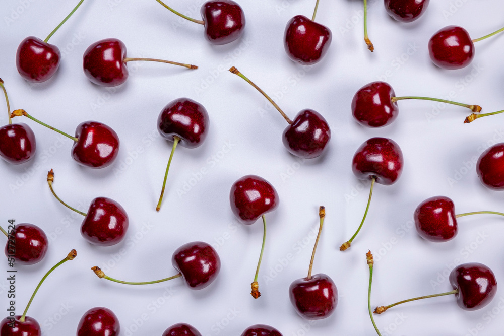 background of ripe cherries with water drops on white background close-up top view background of ripe cherries with water drops on white background close-up top view