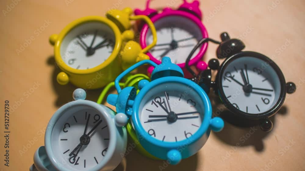 Colorful alarm clocks running in time lapse - hyper lapse, 4k studio footage Colorful alarm clocks running in time lapse - hyper lapse, 4k studio footage