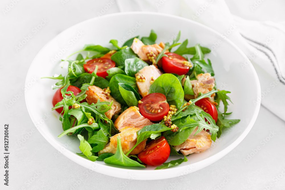 Grilled salmon salad with tomato and salad mix Grilled salmon salad with tomato and salad mix