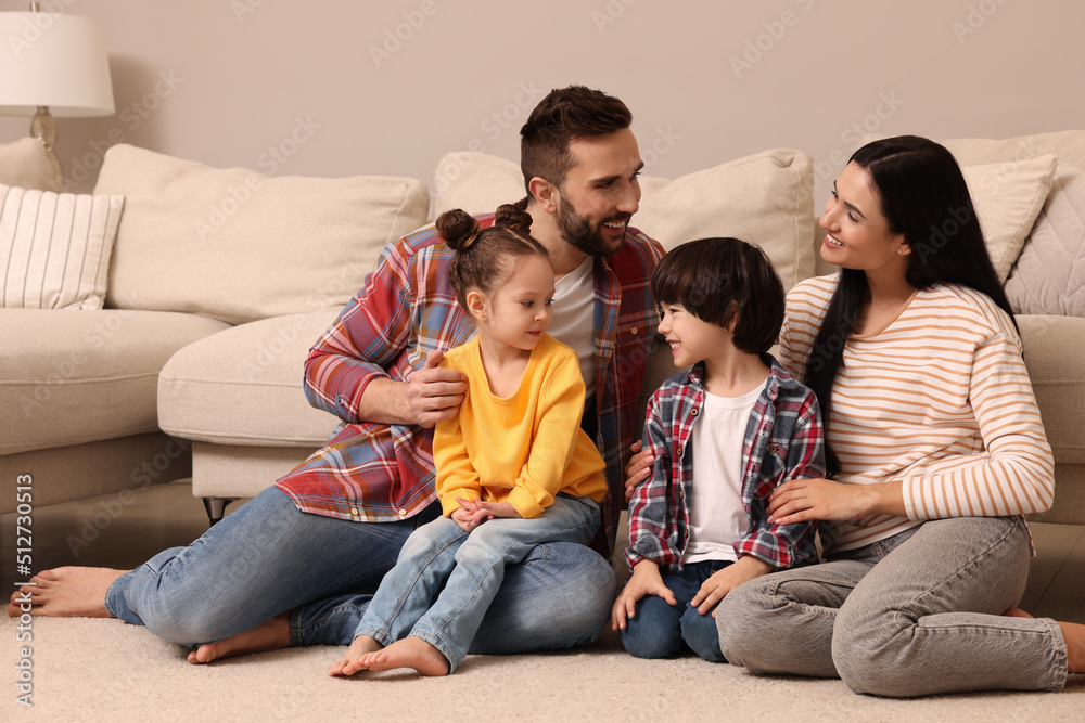 Happy family spending time together in living room Happy family spending time together in living room