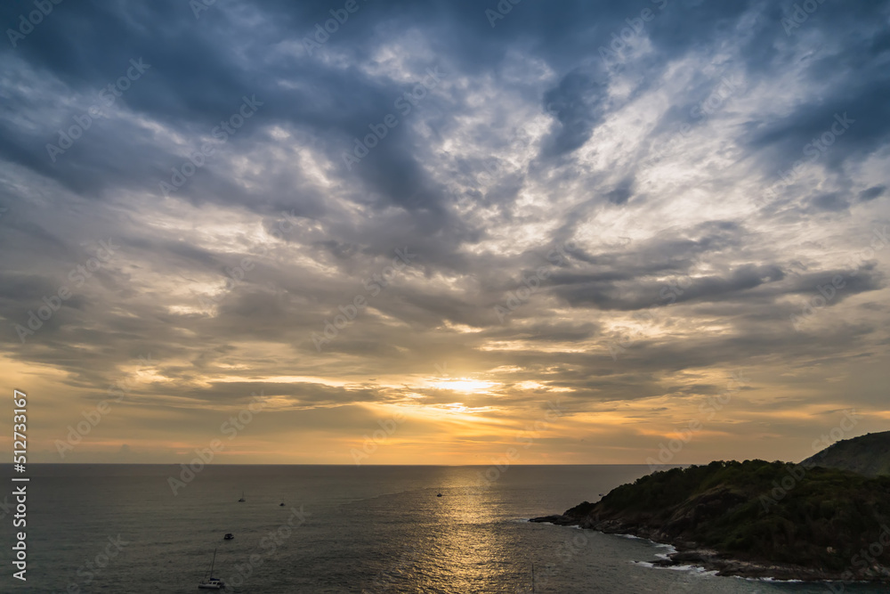 The sun is falling in sunset time at Promthep Cape in Phuket, Thailand. The sun is falling in sunset time at Promthep Cape in Phuket, Thailand.