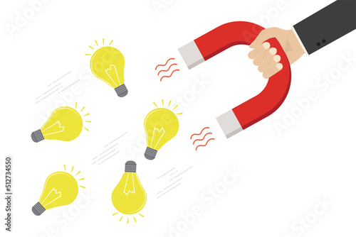 Imagination to create new ideas, creativity or innovation for new business concept, businessman hand holds magnet to magnetize idea lightbulbs. Venture fund attract profitable business ideas.