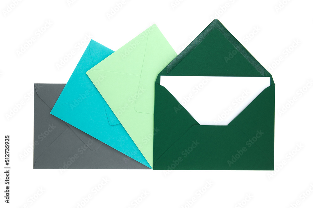 Envelopes of green hues with blank white card Envelopes of green hues with blank white card