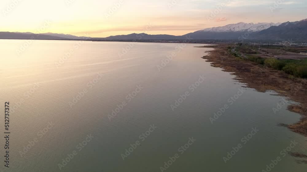 Aerial view along shoreline of Utah Lake where new home construction is in progress expanding for future growth of the population. Aerial view along shoreline of Utah Lake where new home construction is in progress expanding for future growth of the population.