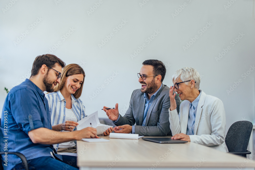 Elegantly dressed people working at the office, doing some paperwork. Elegantly dressed people working at the office, doing some paperwork.