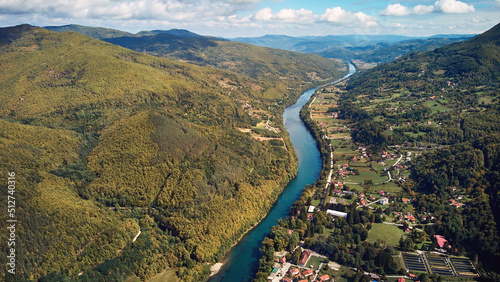 Fototapeta Naklejka Na Ścianę i Meble -  Drone aerial footage of river Drina and Tara mountain hilly landscape in Serbia..