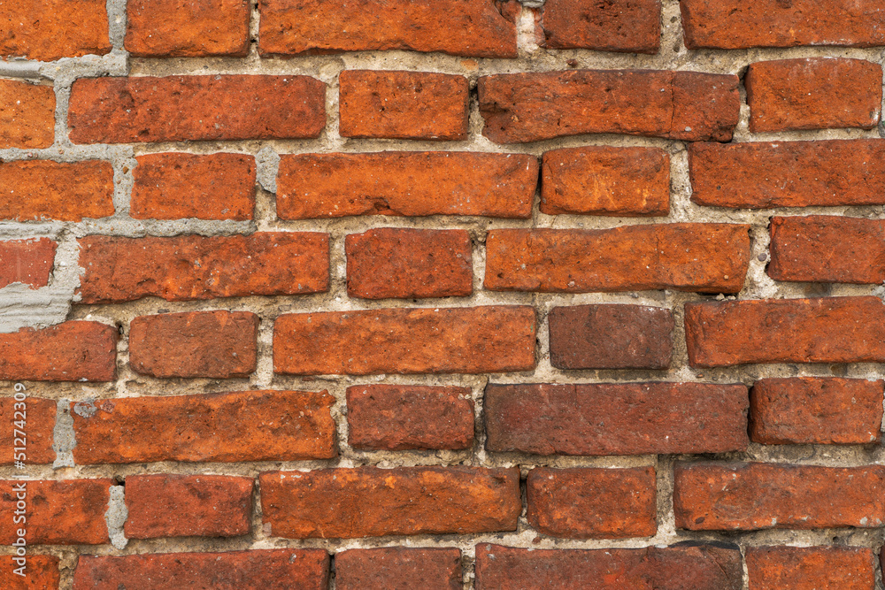 A close up picture of old red brick A close up picture of old red brick