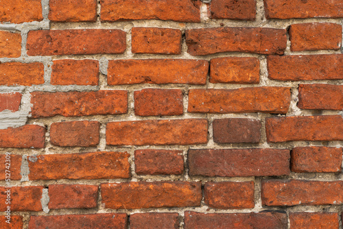 A close up picture of old red brick