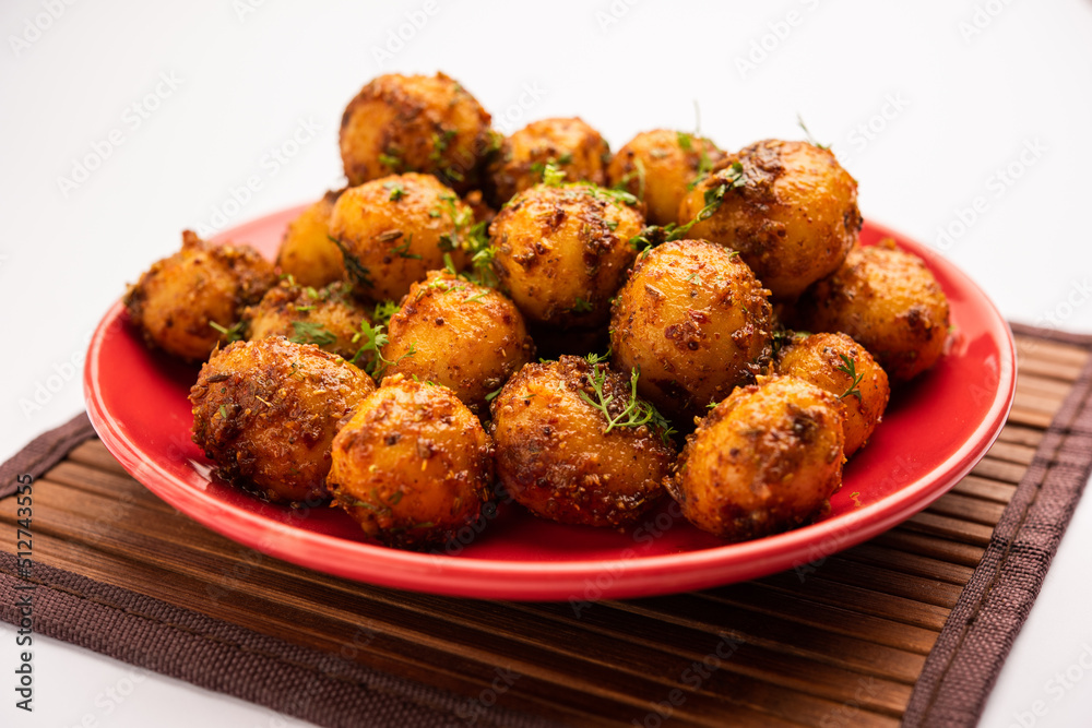 Homemade Roasted Bombay potatoes. Pan fried little baby potatoes or aloo with jeera seeds and coriander in bowl