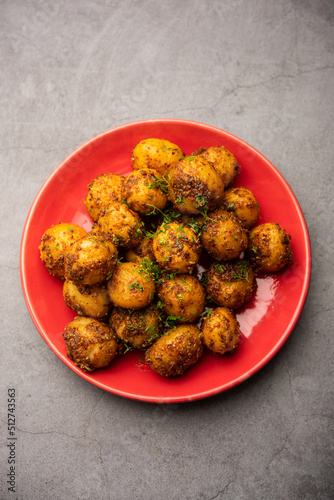 Homemade Roasted Bombay potatoes. Pan fried little baby potatoes or aloo with jeera seeds and coriander in bowl